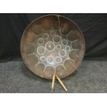 A Guyana steel drum, circular body, shaped and painted note marked top, 57.5cm diameter.