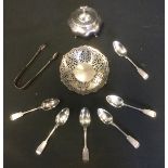 A silver lobed ovoid tea canister; a silver pierced sweetmeat dish; six silver tea spoons, sugar