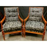 A Pair of 20th century reproduction mahogany open arm chairs, stuffed over upholstery, reeded