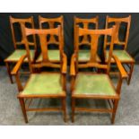 A Set of six Arts and Crafts Oak Dining Chairs, flat columnar splat, tapered square supports and