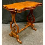 A reproduction Victorian style walnut centre table, shaped top, lyre supports, turned stretcher,