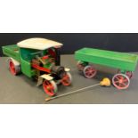 A Mamod SW1 Steam Wagon & Trailer, green and cream, red wheels.