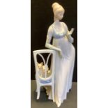 A Lladro Figurine Lady Empire With Tall Chair & Dog, gloss, impressed and printed marks, 48cm