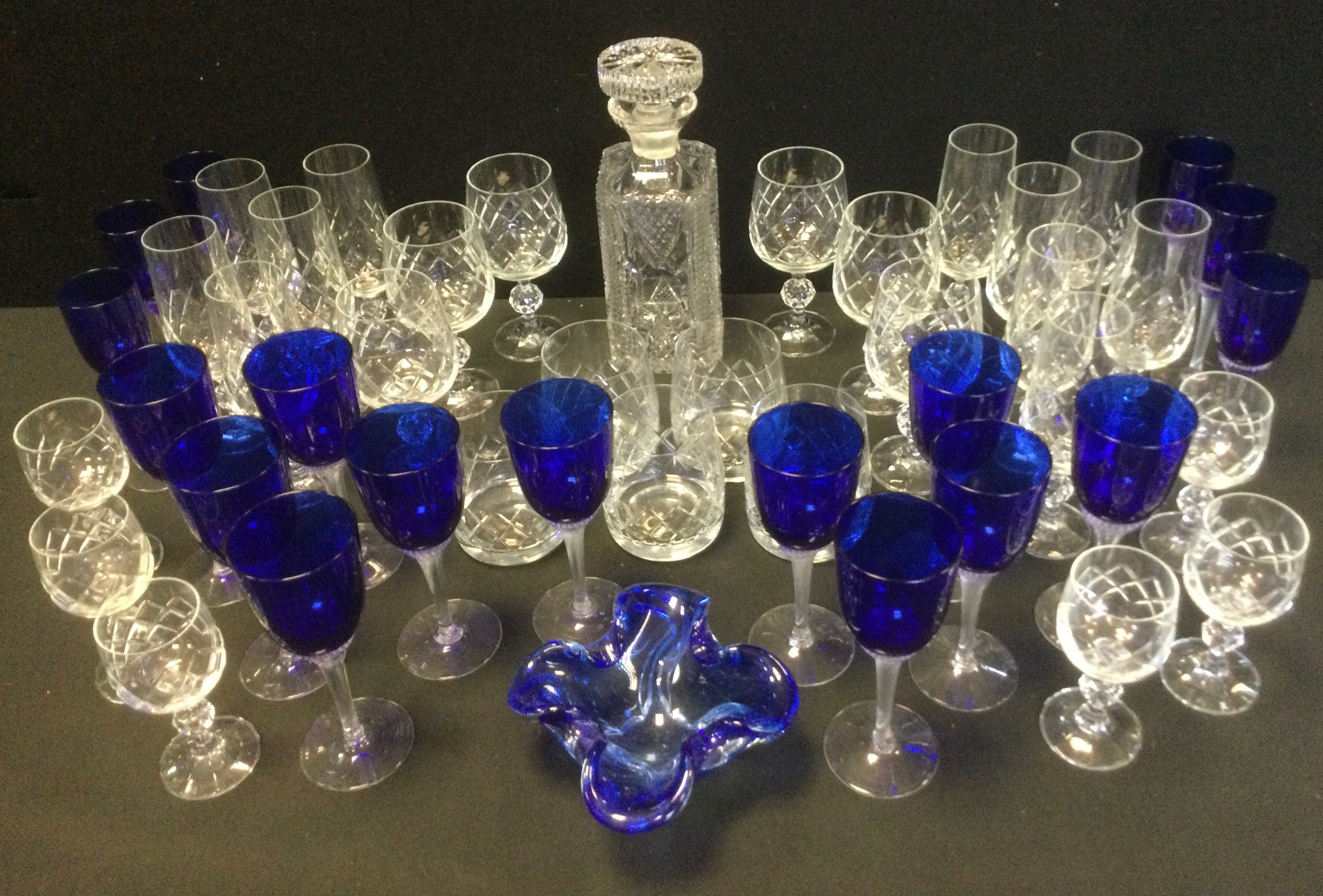 Glassware - a set of eleven blue glass wine glasses; a cut glass decanter, whiskey cups; ect.