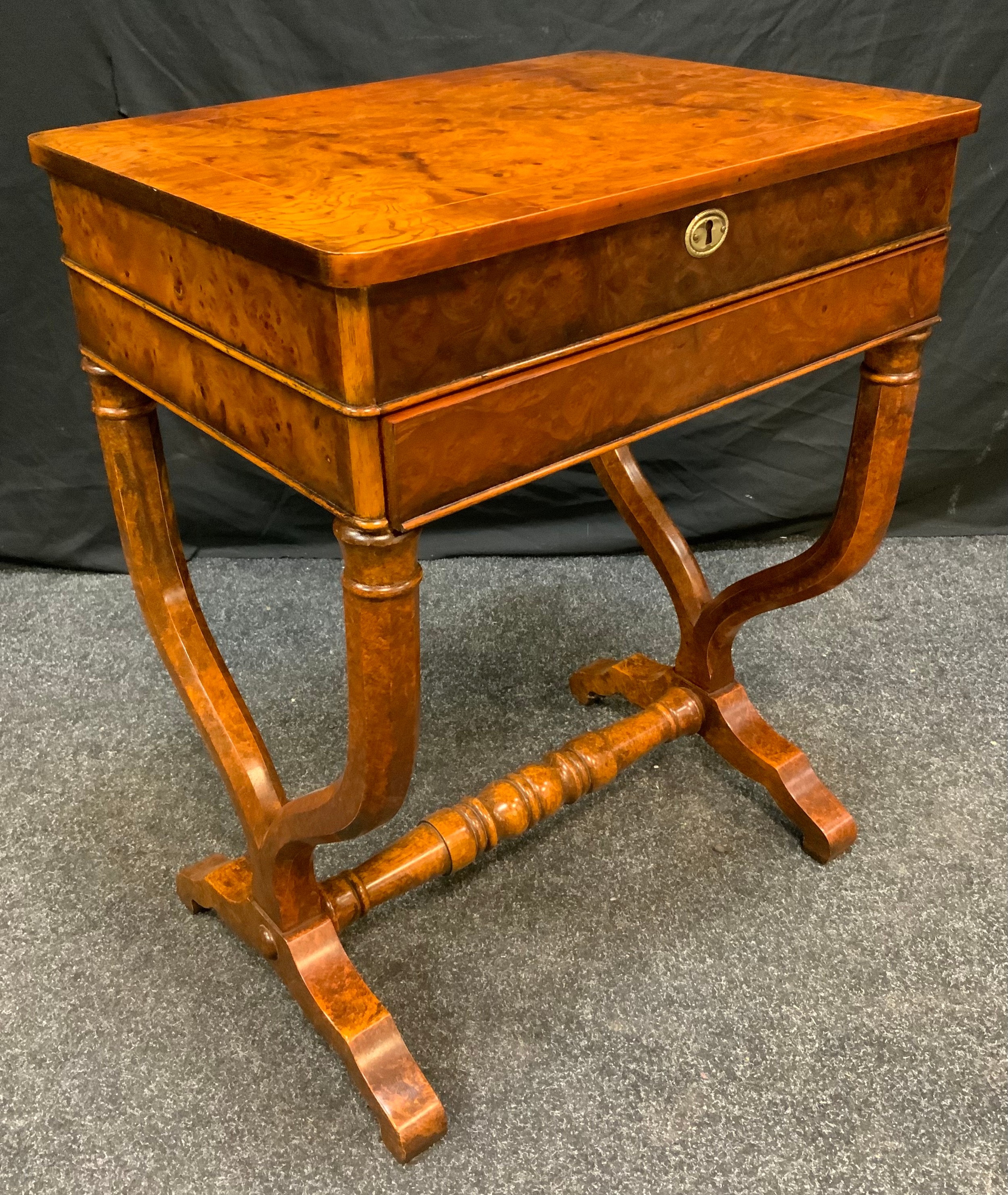 A Reproduction Burr Walnut veneer workbox table, rounded rectangular top, boxwood stringing,