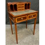 A 20th century George III style reproduction mahogany Bonheur du Jour, having three small drawers,