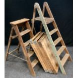 A Set of early 20th century pine, four rung, step ladders; another set, smaller; and three large