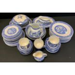 Blue and white - a 19th century Willow pattern part dinner service, comprising six cups, dinner