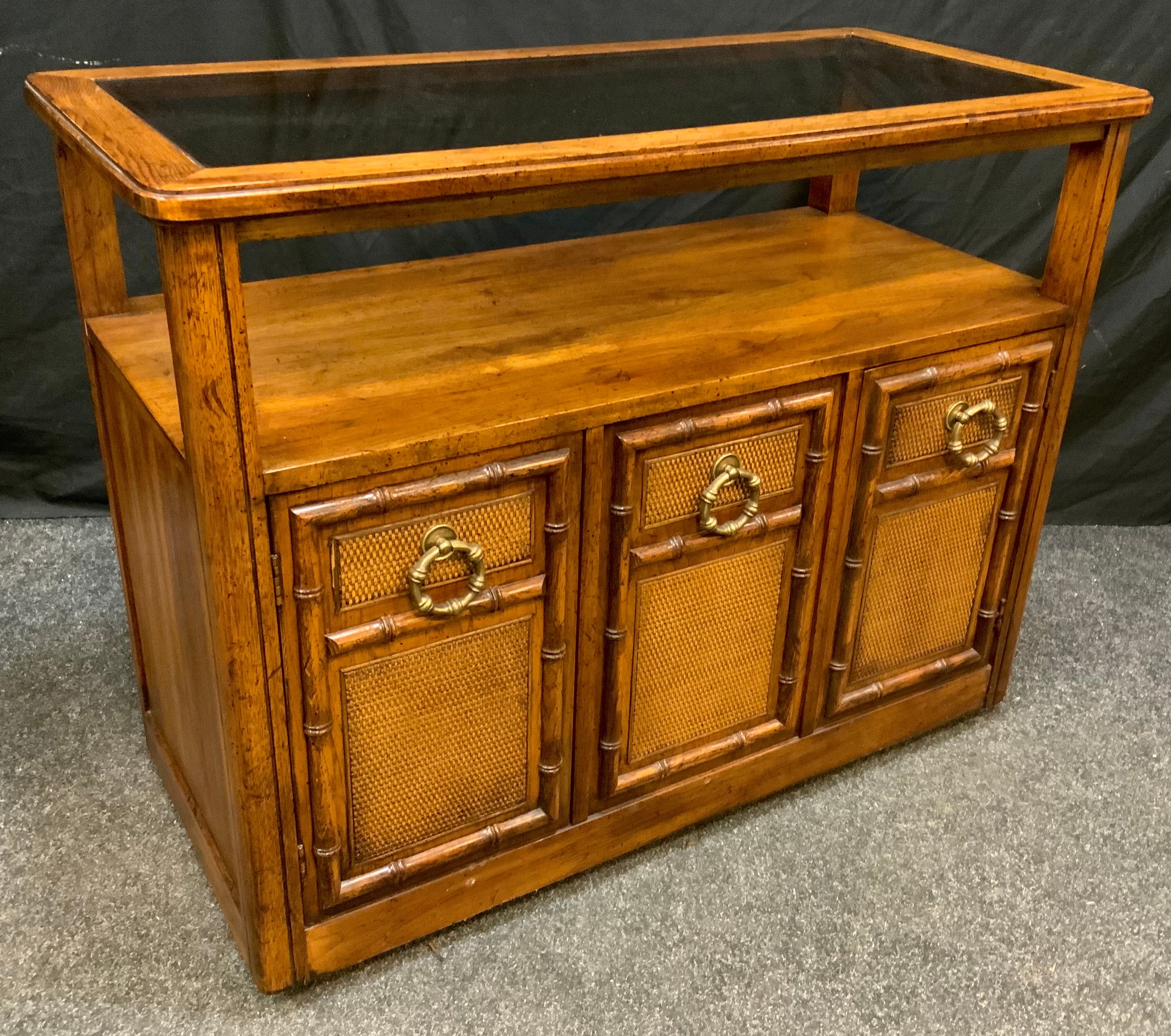 A Contemporary 'Drexel' style, walnut side table/cabinet, rounded rectangular oversailing top with