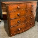 A Victorian mahogany chest of drawers, bow-fronted top above two short and three graduated