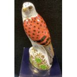 A Royal Crown Derby paperweight, Kestrel, gold stopper, boxed;