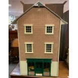 A modern Tillys Tea shop three storey dolls house, the interior fitted with a large quantity of