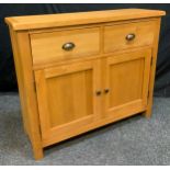 A Contemporary Oak Side/Hall Cabinet, two short drawers, above two cupboard doors enclosing