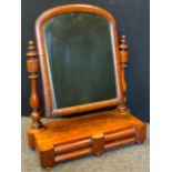 An Early Victorian Mahogany Toilet Mirror, arched top mirror, and turned supports, above a pair of