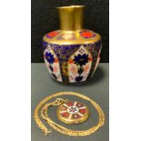 A Royal Crown Derby 1128 mallet vase, seconds; a gold plated circular locket pendant necklace,