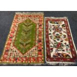 A Kendal Milne & Co woollen rug, central floral medallion with green ground, within five section