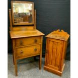 A 20th century oak dressing table of narrow proportions, central rectangular mirror above a