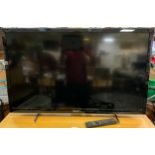 A Sony Bravia LCD television, 40 inch screen, model KDL40-753, with stand and remote control.