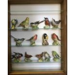 A Beswick model bird, Whitethroat style one open beak, 2106A; others Wren 993A and 993B;