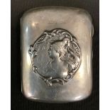 An Art Nouveau silver cigarette case, embossed with an Alphonse Mucha style portrait front, dated