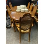 A 20th century drexal style oak extending dining table, oval top tapered square legs, 74cm high x