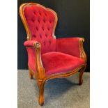 An early 20th century, reproduction Victorian style stained beechwood armchair, 100cm tall.