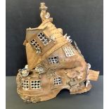 Studio pottery - A Penally Pottery shoe house, signed P A Day. 45cm high x 42 cm wide.