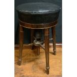An Edwardian mahogany piano stool, circular padded seat, reeded legs, 39cm high, 33cm wide.