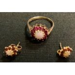 A Ruby and opal floral cluster ring, 9ct gold mount; pair of conforming earrings, 3.3g gross