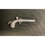 A Novelty Sampson Mordan silver slide action flintlock pistol propelling pencil, signed S Mordan,