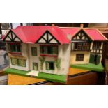 A mid 20th century Ceebee toys two storey dolls house, lattice tin plate doors and windows, 42cm