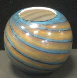 A Whitefriars style spherical form studio range glass vase, with spiralled vortex exterior including