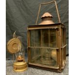 A Late 19th century copper wall hanging oil lantern; a brass oil lamp.(2)