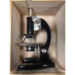 A Prior of London monocular microscope, triple revolving optic mount, black body, no 17073, cased
