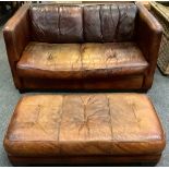 A Tan Leather, High-arm two-seat sofa, with conforming long foot stool.