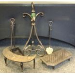 A Wrought iron companion set; a cast iron lantern, wrought iron and cast trivets.(6)