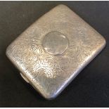 An Edwardian silver arched rectangular cigarette case, scrolling floral decoration, Deakin &