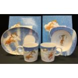A Portmeirion The Snowman mug and bowl set, another both boxed.