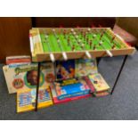 A French table football table; board games and puzzles, ludo, Frustration, Tip-it, Intercom