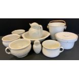 A white separating bucket; five piece relief decorated washing set, jug, bowl, toothbrush holder