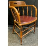 A Late 19th century, oak bentwood armchair, turned spindles, padded leather seat, turned legs,