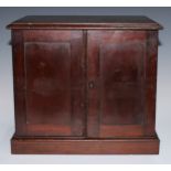 A 19th century table cabinet, moulded oversailing top above a pair of panelled doors enclosing two