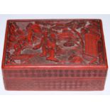 A Chinese cinnabar lacquer rectangular box and cover, carved in relief with figures beside a pagoda,