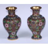 A pair of Chinese cloisonne enamel ovoid vases, applied and decorated in polychrome with flowers and