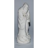 A Chinese blanc de chine figure, of an immortal holding a scroll, 14.5cm high