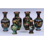 A pair of Chinese cloisonne enamel ovoid vases, decorated in the famille noir palette with flowers