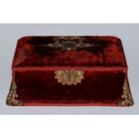 A Baroque Revival gilt-metal mounted claret plush velvet jewel casket, the slightly domed hinged