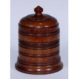 Treen - a 19th century turned oak country house tobacco jar and cover, knop finial, lead doubter,