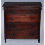 A 19th century mahogany miniature chest, oversailing rectangular top above four long graduated