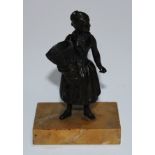 A 19th century dark patinated cabinet bronze, of a lady holding a basket, rectangular sienna